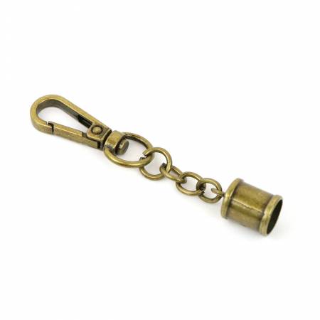 Two Tassel Caps With Swivel Antique